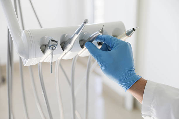 Professional Tooth Extraction technician working in New Albany, MS